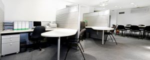 office with white desks and black office chairs