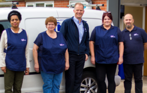 sean with a group of cleaning operatives standing against a Cleaning Technique van