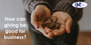 featured image of a blog about how giving can be good for business showing hands outstretched with coins as an offering