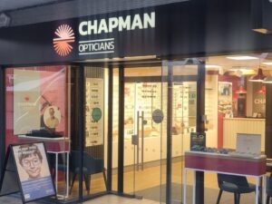 Image showing the shopfront of Chapman Opticians with a sandwich board outside that reads, "Does your child have Miopia?"